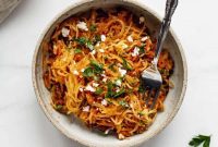 Golden Spaghetti Squash with Tangy Sun-Dried Tomatoes and Sweet Caramelized Onions