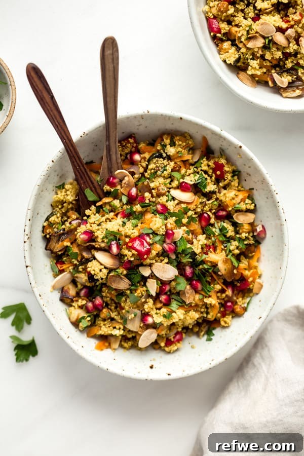 A metal mixing bowl filled with the freshly prepared Moroccan quinoa salad, highlighting its rich colors and textures before serving.