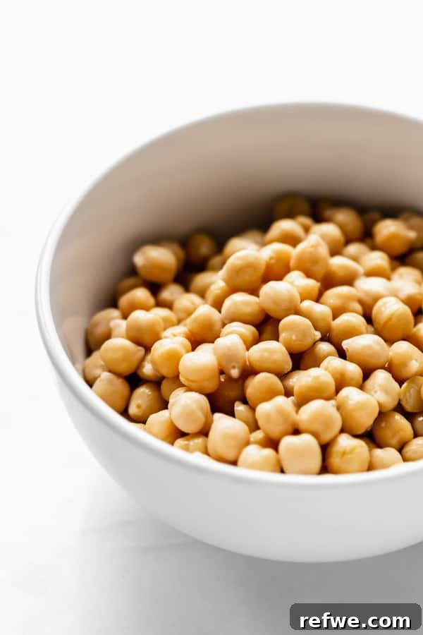 Roasted Chickpea Remix: Three Flavorful Variations 3 Dried chickpeas in a bowl, perfectly prepped for roasting.