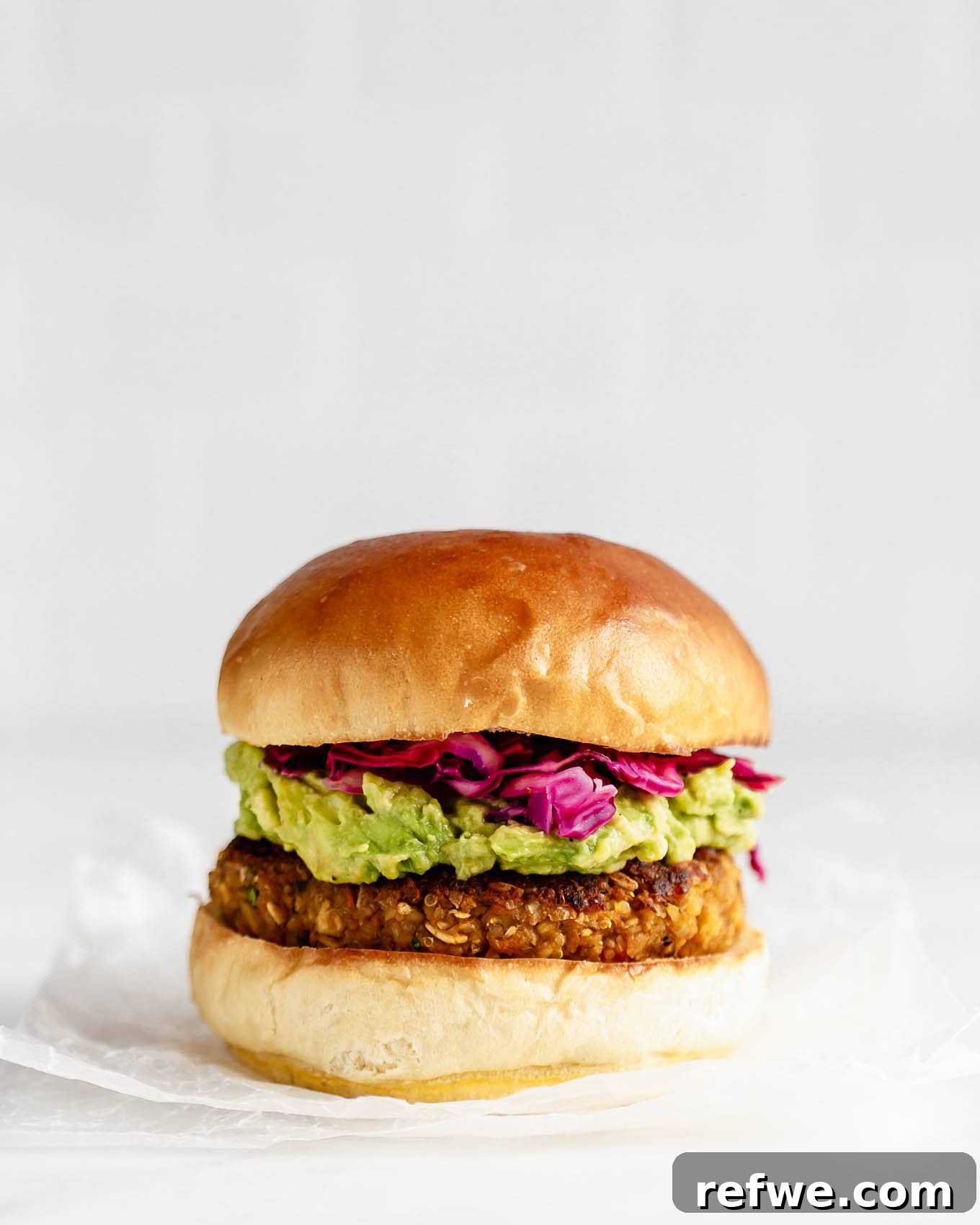 Your New Favorite Chickpea Burgers 10 A perfectly cooked chickpea burger resting on parchment paper, ready to be assembled and enjoyed.