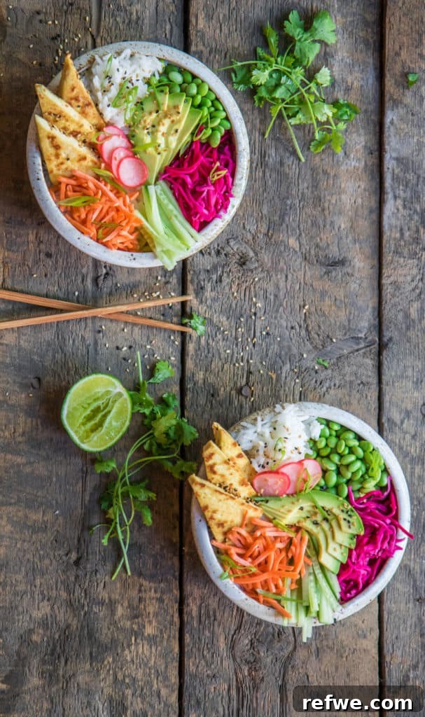 Close-up of coconut jasmine rice with sesame tofu and fresh vegetables