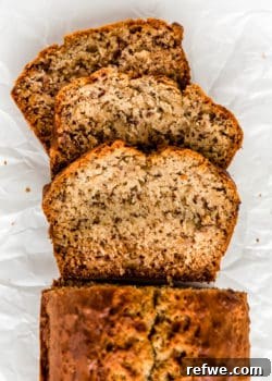 Slices of vegan banana bread on parchment paper