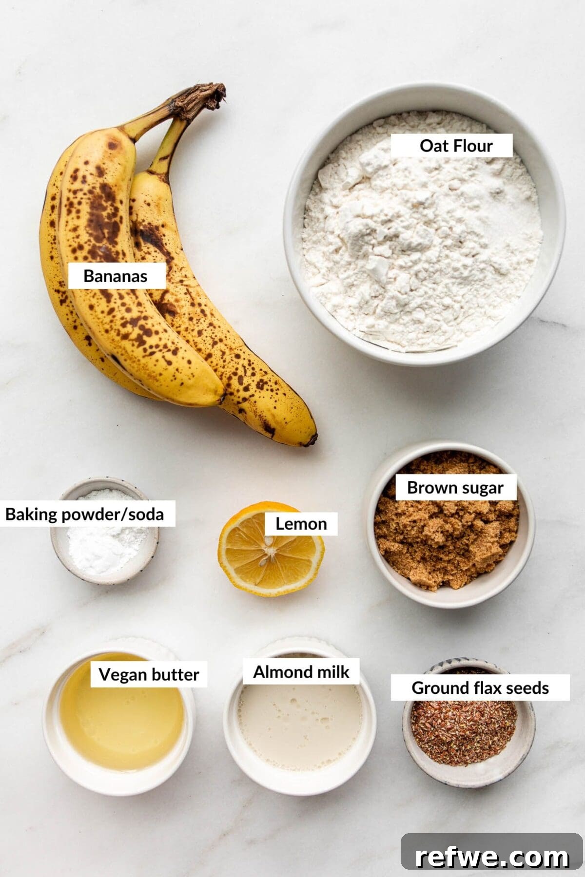 Collection of key ingredients to make vegan gluten-free banana bread, neatly arranged for baking.