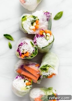 Fresh Vietnamese spring rolls on a marble board, ready to be served.
