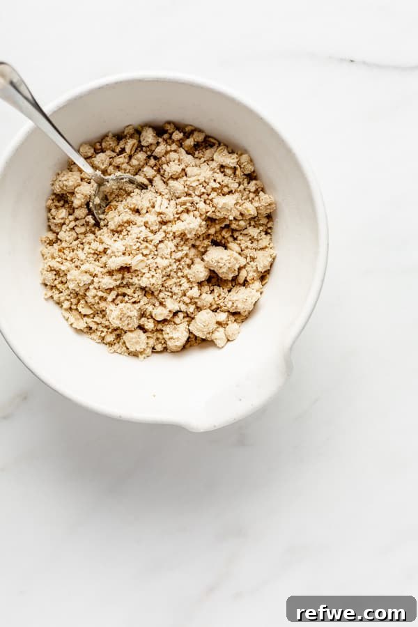 Golden Raspberry Crumble Bars 4 The perfectly crumbly dough mixture in a mixing bowl, ready to be pressed into the baking pan.