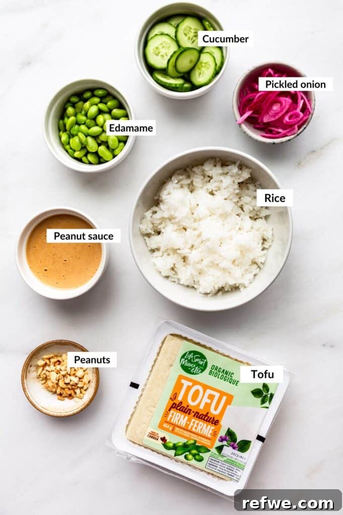 Peanut Tofu Power Bowls 3 A flat lay photograph showcasing all the fresh ingredients required to prepare the healthy and flavorful peanut tofu bowls, including tofu, vegetables, and the creamy peanut sauce components.