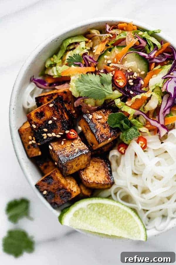 Mastering Plant-Based Protein 8 A bowl filled with Vietnamese salad, rice noodles, and lemongrass tofu