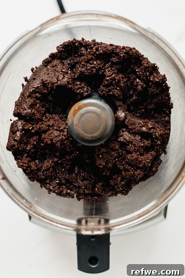 Decadent No-Bake Fudge Brownies 5 blended no bake brownie mixture in a food processor