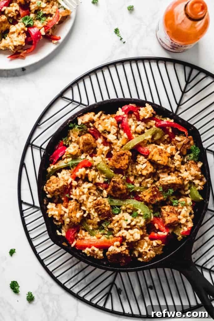 25 Delicious Vegan Dinners Made Easy 21 Hearty Cajun Tempeh and Wild Rice Skillet, rich with spices and vegetables