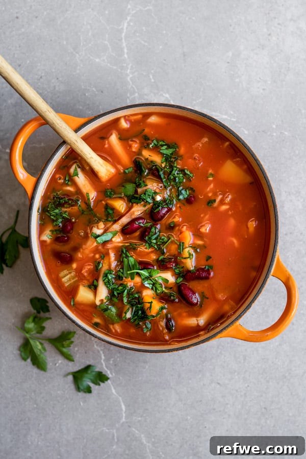 25 Delicious Vegan Dinners Made Easy 7 A steaming bowl of One-Pot Vegan Minestrone Soup, rich with pasta and vegetables