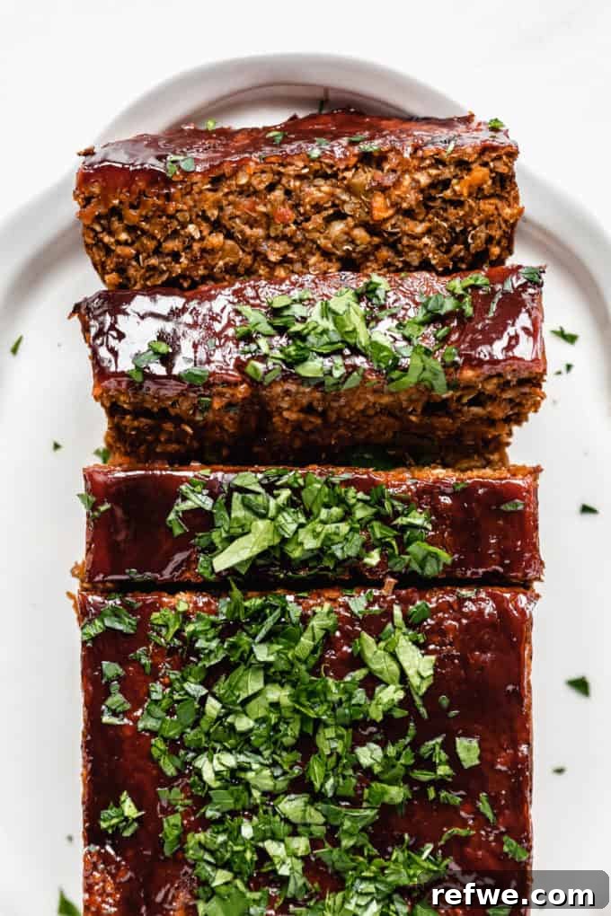 Comforting Plant-Based Lentil Loaf 7 A vegan lentil loaf topped with a ketchup glaze and parsley