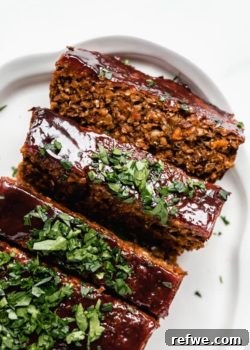 lentil loaf sliced topped with fresh parsley
