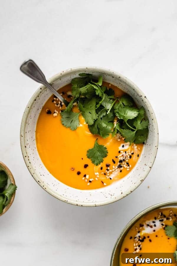 Mastering Butternut Squash Cooking 3 A delicious bowl of butternut squash soup garnished with fresh cilantro, ready to be served