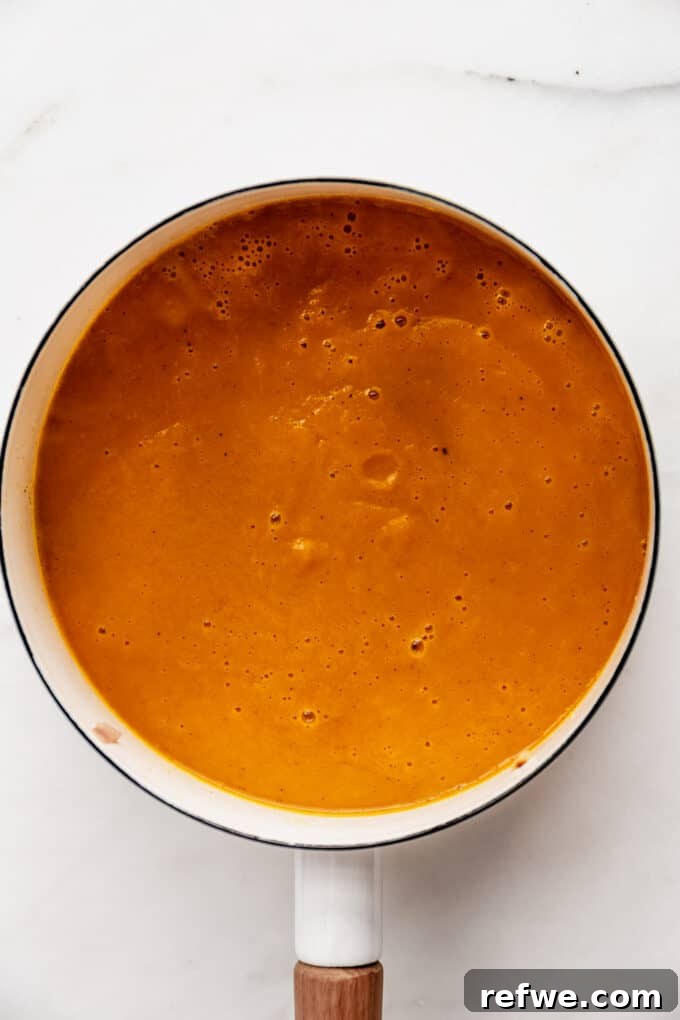 Warming Roasted Sweet Potato Carrot Ginger Soup 8 sweet potato carrot and ginger soup in a pot