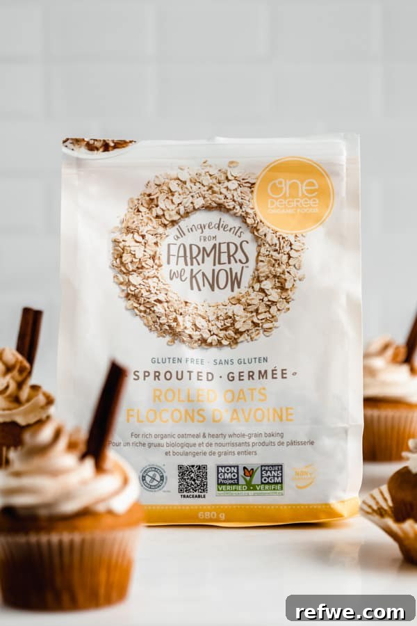 Cozy Vegan Pumpkin Spice Latte Cupcakes 3 One Degree Organics Sprouted Rolled Oats next to freshly baked vegan pumpkin cupcakes, highlighting a key ingredient