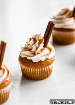 A perfectly frosted vegan pumpkin spice latte cupcake, ready to be enjoyed.