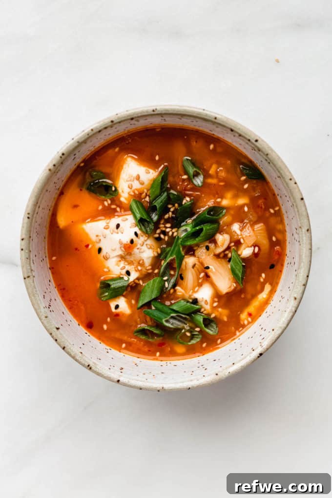 Spicy Korean Soft Tofu Stew 2 Korean Tofu Soup in a speckled bowl topped with green onions