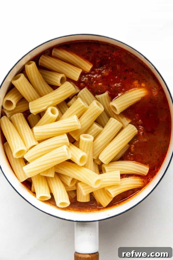 Rich Ricotta Vegetarian Ziti Bake 7 tomato sauce and ziti noodles in a pot