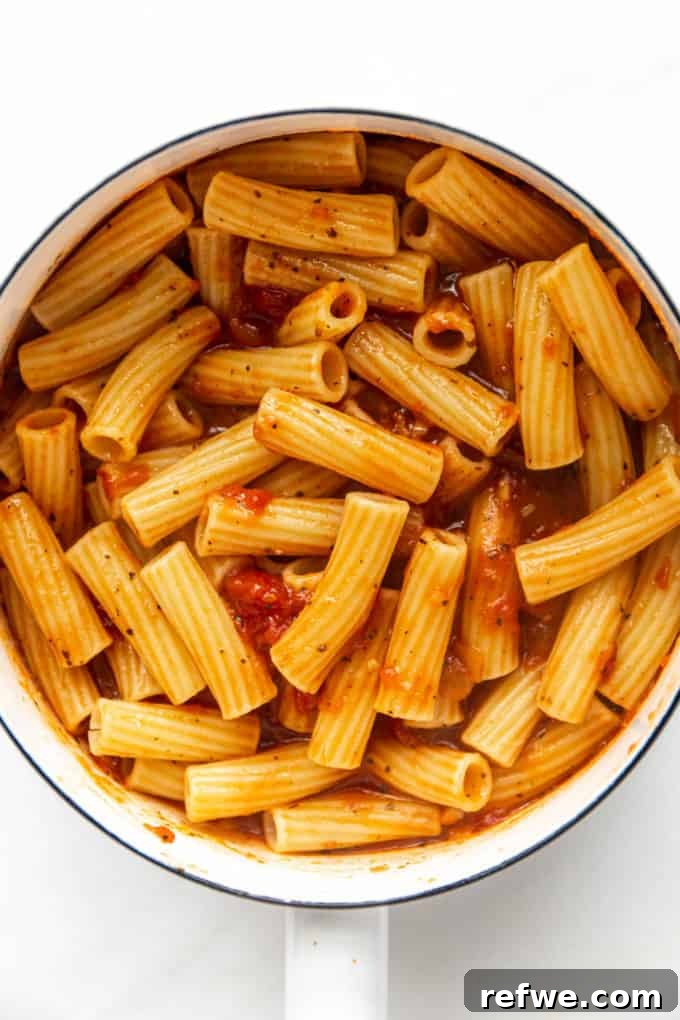 Rich Ricotta Vegetarian Ziti Bake 8 ziti noodles in tomato sauce in a white pot