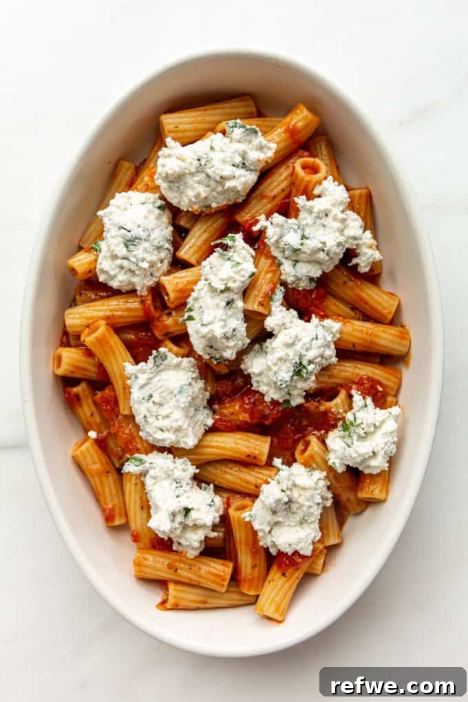 Rich Ricotta Vegetarian Ziti Bake 10 ziti noodles, tomato sauce and ricotta in a baking dish