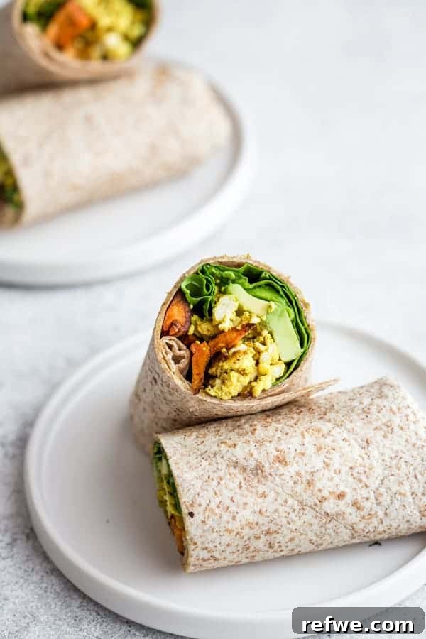 Quick Nutritious Morning Meals 15 breakfast burrito cut in half on a white plate, with another breakfast burrito behind it