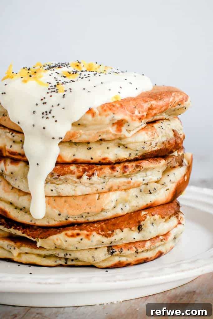 Quick Nutritious Morning Meals 7 healthy breakfast plate of lemon poppyseed pancakes topped with white yogurt, poppyseeds, and lemon zest
