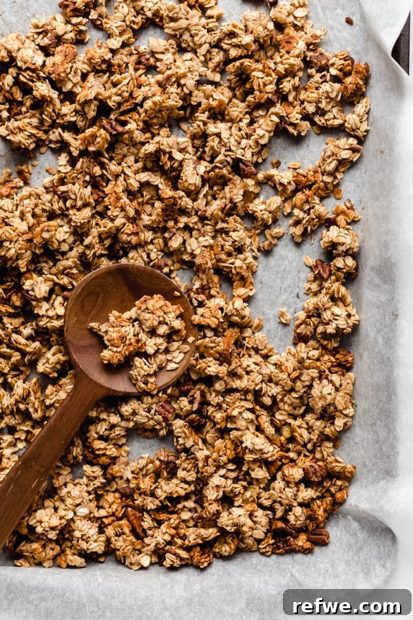 Spiced Banana Bread Granola 7 Freshly baked banana bread granola spread across a baking sheet, golden and perfectly toasted.