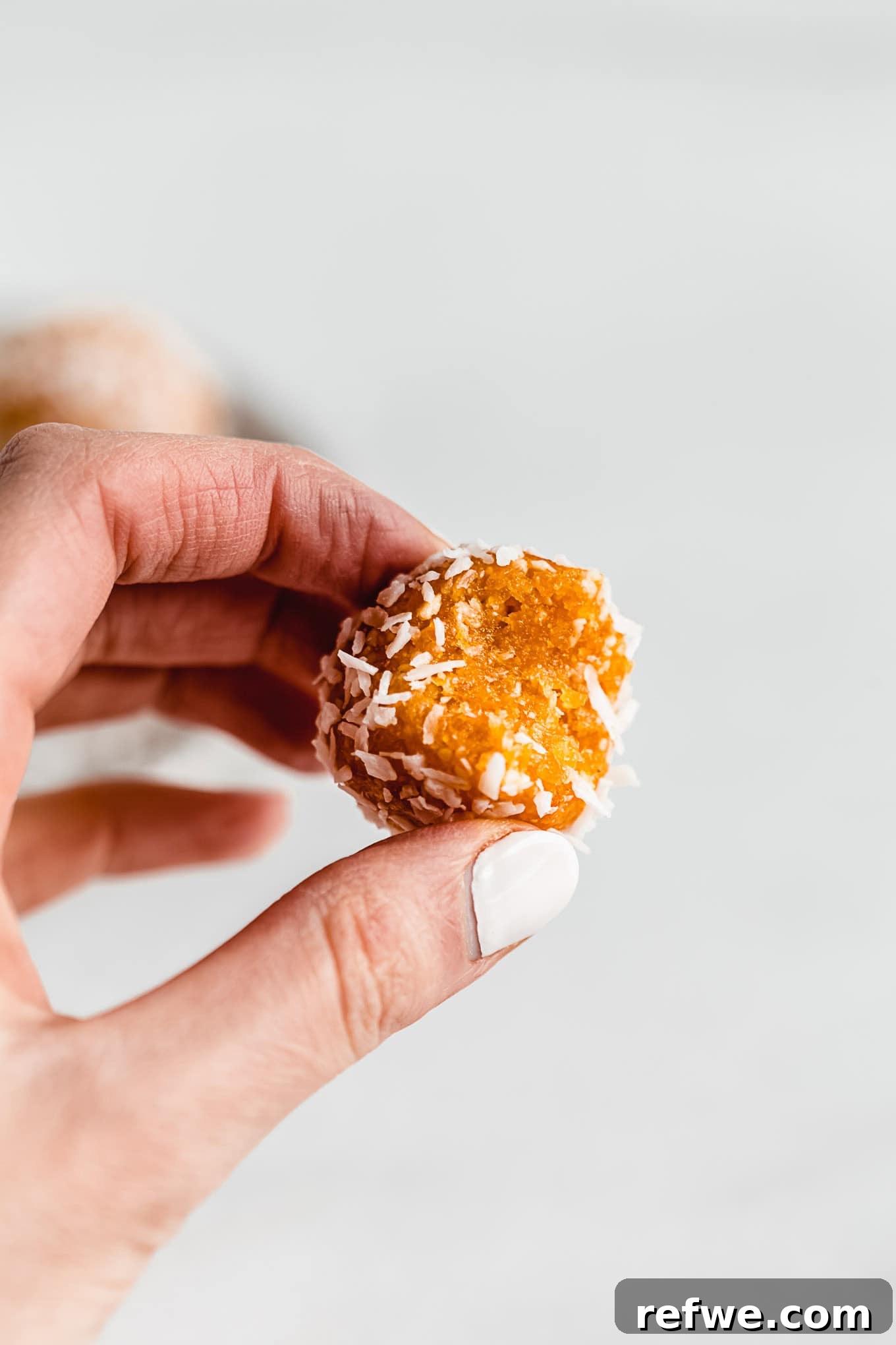 Sun Kissed Apricot Coconut Power Bites 7 A neatly arranged stack of finished Coconut Apricot Energy Balls, perfectly chilled and ready to eat.