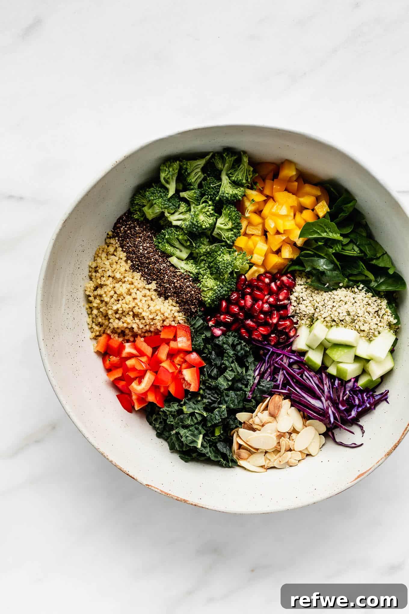 Vibrant Vitality Bowl 3 A beautifully arranged bowl of Superfood Salad, showcasing the colorful ingredients before dressing.