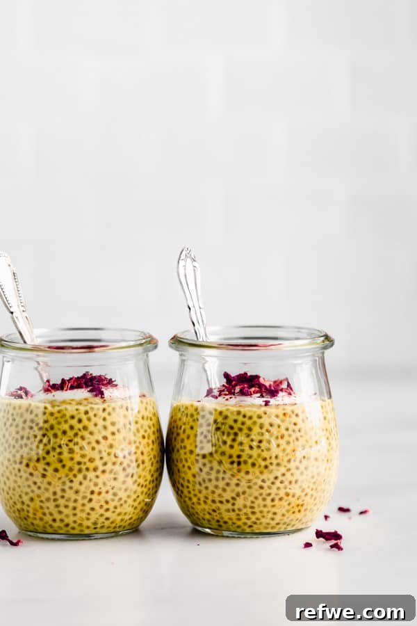 Golden Glow Chia Pudding 9 Two aesthetically pleasing jars of golden milk chia pudding, each with a spoon, inviting a moment of healthy indulgence.