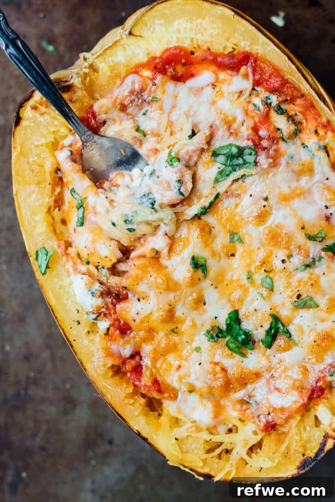 Delicious Vegetarian Lasagna Stuffed Spaghetti Squash baked to golden perfection