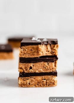 A stack of three homemade chocolate peanut butter protein bars