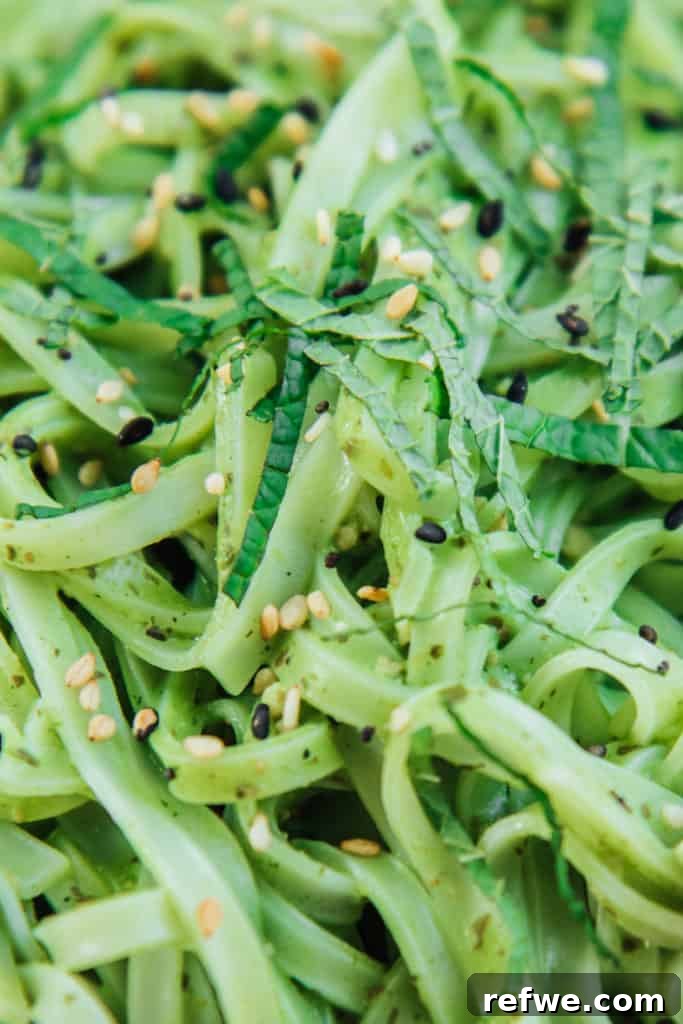 Linguine with Creamy Thai Pesto 3 Close-up of creamy Thai pesto linguine garnished with fresh green onions and sesame seeds