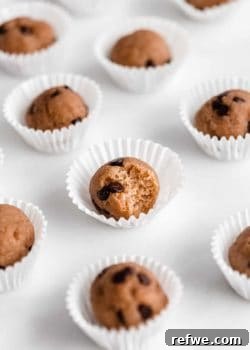 Protein Packed Cookie Dough Bites 11 Chocolate chip cookie dough ball with a bite taken out of it
