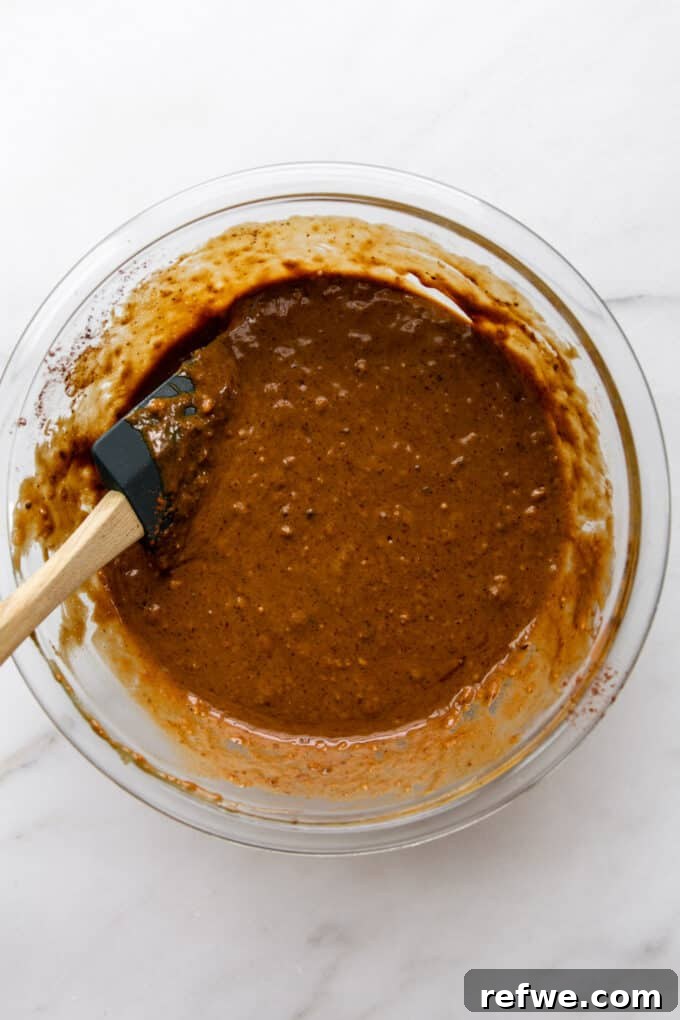 Gingerbread muffin batter mixed in a bowl
