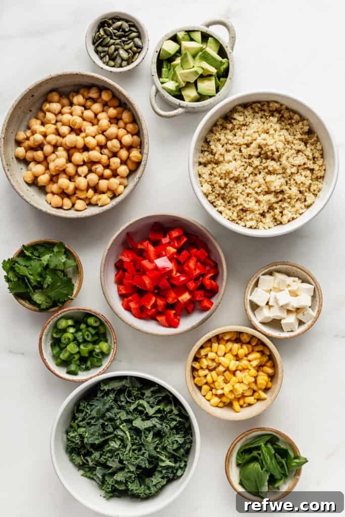 Vibrant Green Goddess Quinoa Bowl 3 Assorted fresh ingredients for a quinoa power bowl laid out on a marble table