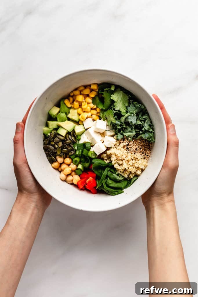 Vibrant Green Goddess Quinoa Bowl 4 Hands holding a vibrant quinoa power bowl