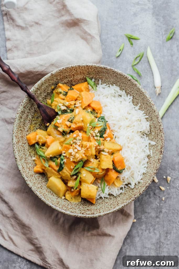 Tropical Roasted Sweet Potato Pineapple Curry 3 Close-up of roasted sweet potato and pineapple curry, showing texture and vibrant colors.