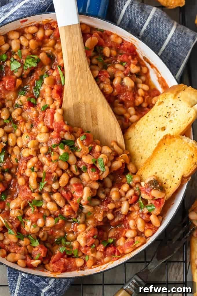 21 Amazing Meals from a Single Can of Beans 7 A comforting dish of white beans simmered with tomatoes and garlic