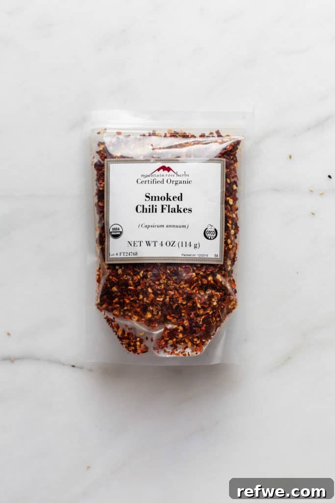 Plant-Based Dan Dan Delight 4 A package of Mountain Rose Herbs smoked chili flakes, showcasing the quality ingredient.