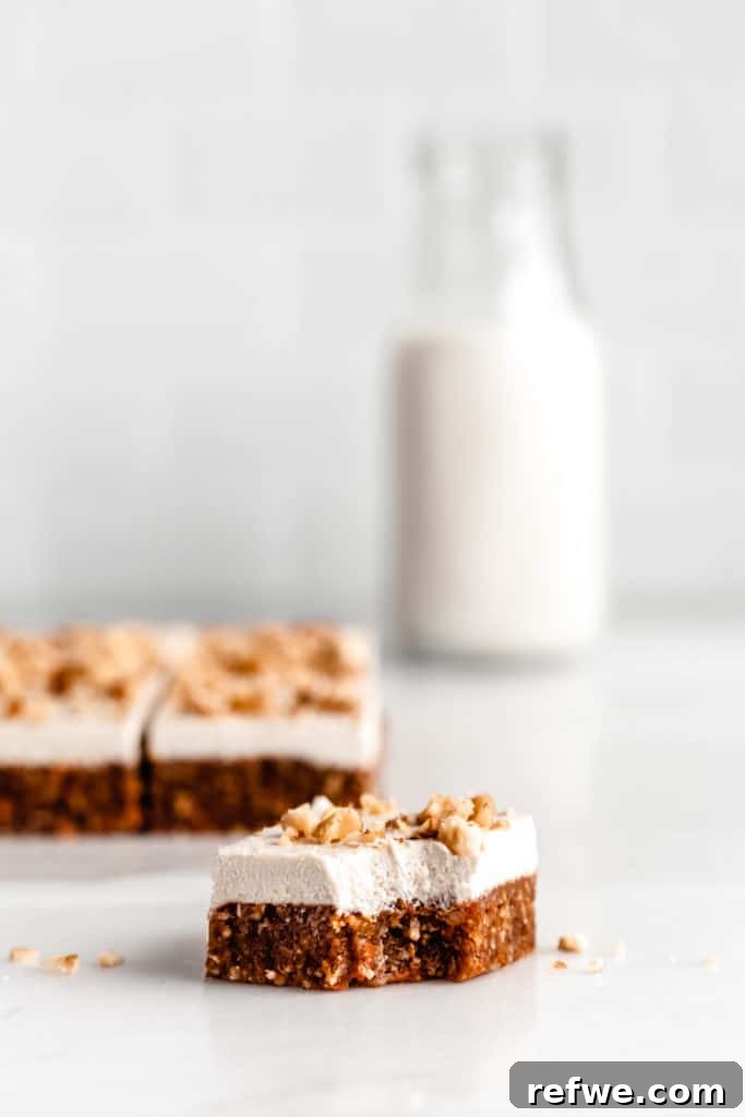 Guilt-Free Raw Vegan Carrot Cake 2 a square of raw carrot cake with a bite taken out of it
