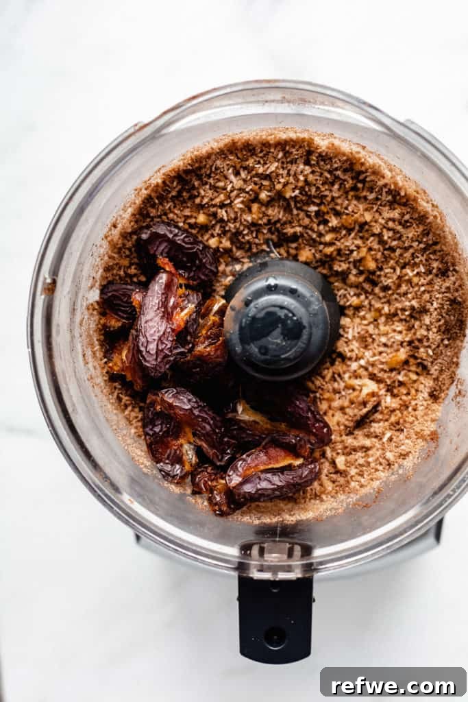 Guilt-Free Raw Vegan Carrot Cake 4 a food processor with blended nuts and dates in it