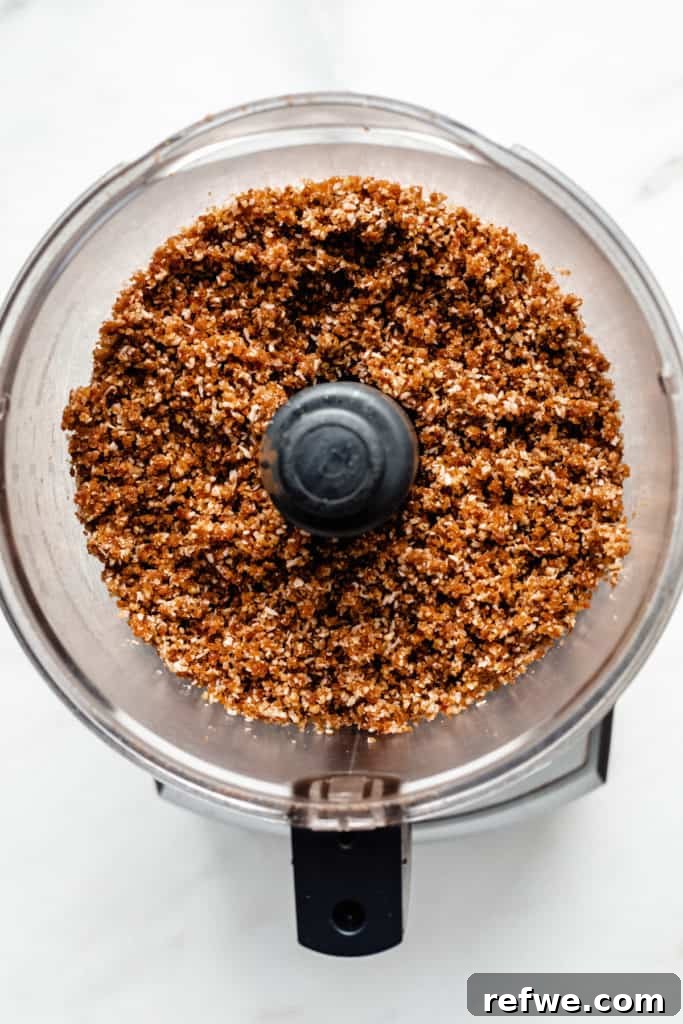 Guilt-Free Raw Vegan Carrot Cake 5 a crumbly raw mixture of dates and nuts in a food processor