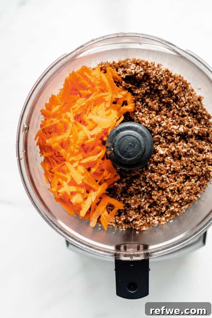 Guilt-Free Raw Vegan Carrot Cake 6 shredded carrots and raw carrot cake dough in a food processor