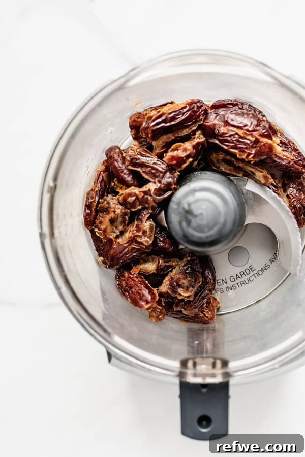 Supercharged Granola Fuel 3 a food processor with dates in it