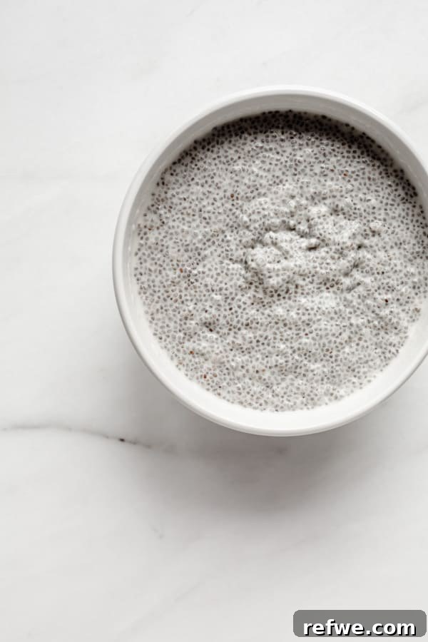 Chia Seeds Unlocked Your Comprehensive Guide to Recipes and Wellness 2 A close-up shot of dry chia seeds, highlighting their small size and varied black and white specks.
