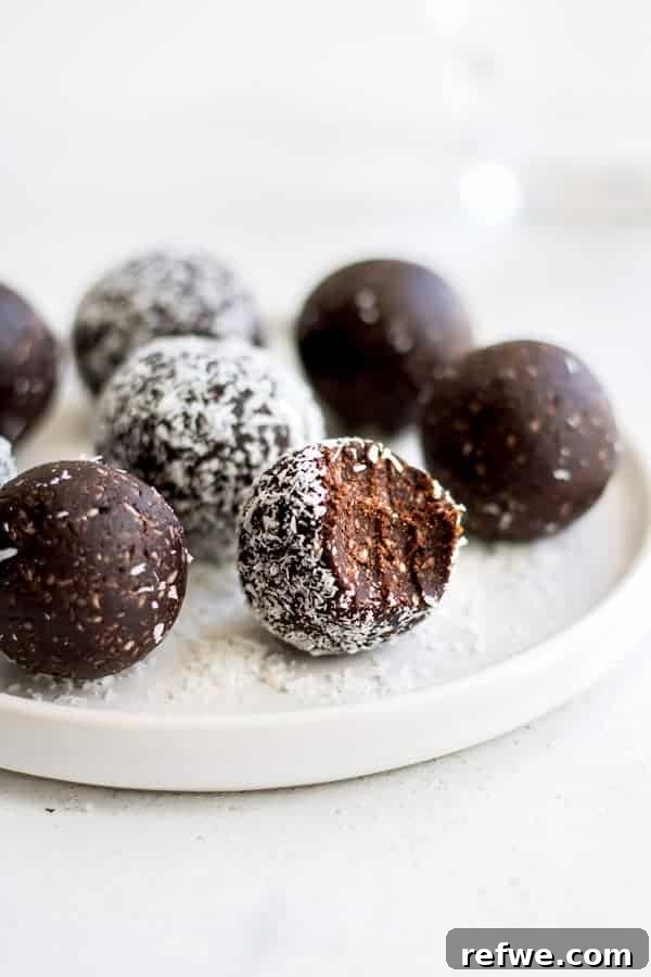 A pile of chocolate macaroon energy balls, perfectly round and inviting.