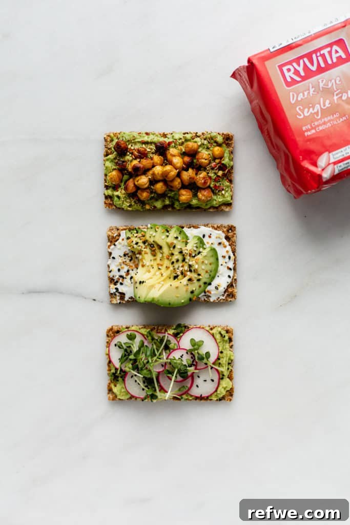 Avocado Toast: Three Creative Twists 3 Three golden Ryvita crispbreads, each generously spread with mashed avocado, arranged beside a full package of Ryvita, highlighting the fresh ingredients and the wholesome base.