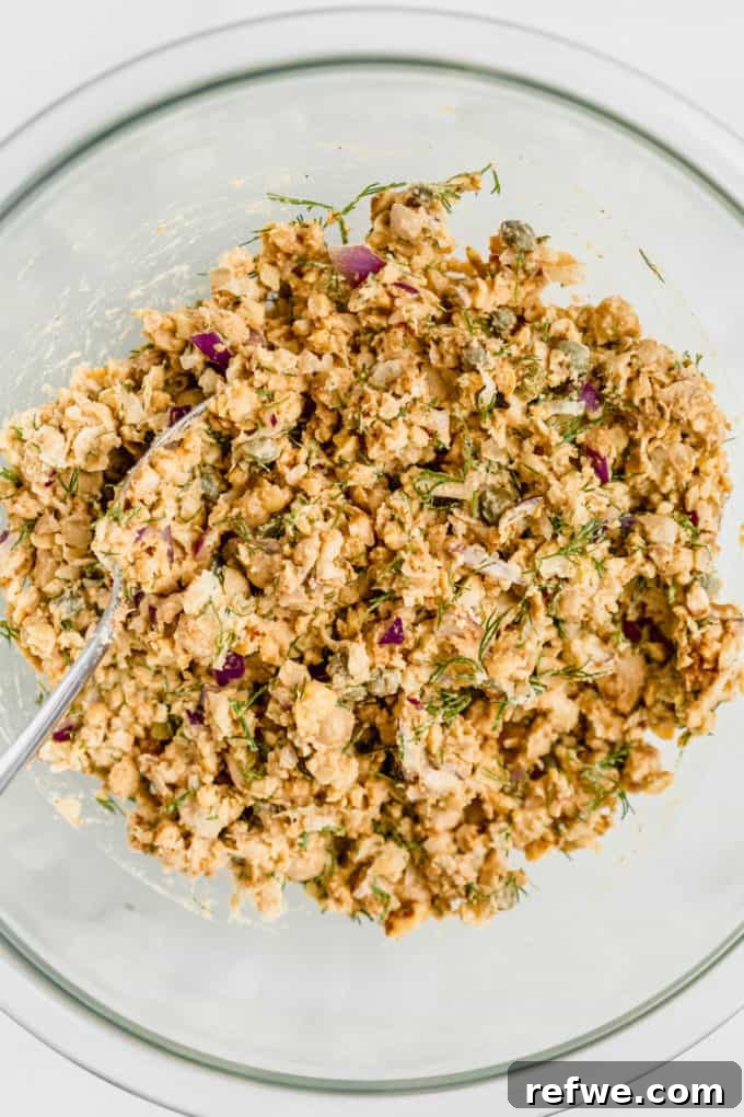 smashed chickpea salad in a mixing bowl