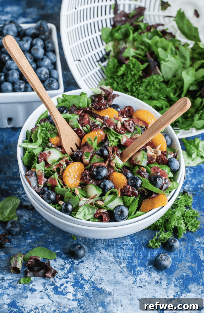 Cranberry Blueberry Salad with Blueberry Balsamic Dressing on a bed of greens